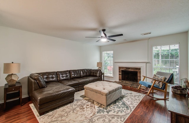 3411 Deeds Rd, Houston, TX 77084 - living room with wood finished floors, ceiling fan, and a fireplace