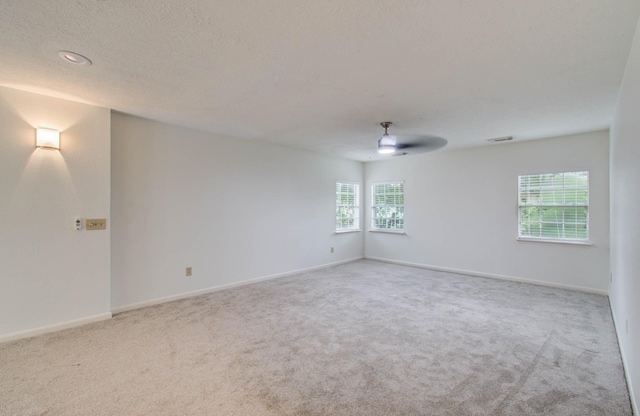 3411 Deeds Rd, Houston, TX 77084 - carpeted empty room featuring plenty of natural light