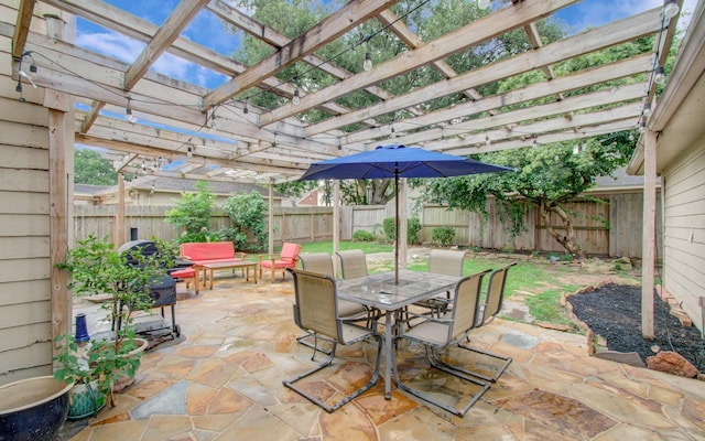 3411 Deeds Rd, Houston, TX 77084 - fenced backyard with outdoor dining space, a pergola, and a patio