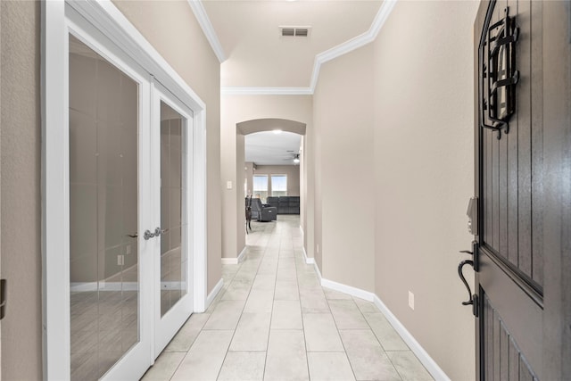 19647 Travis Cannon Ln, Richmond, TX 77407 - hallway featuring french doors, crown molding, light tile patterned floors, and arched walkways