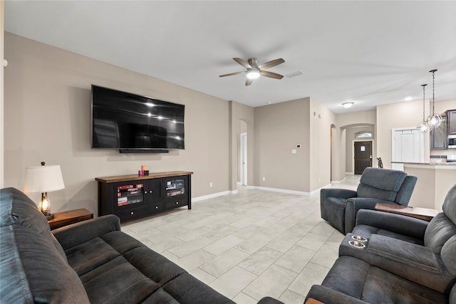 19647 Travis Cannon Ln, Richmond, TX 77407 - living area with arched walkways and ceiling fan