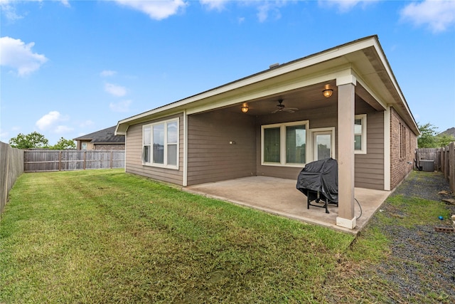 19647 Travis Cannon Ln, Richmond, TX 77407 - back of property with a fenced backyard, a patio area, and a ceiling fan