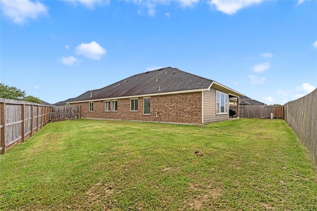 19647 Travis Cannon Ln, Richmond, TX 77407 - back of property with brick siding and a fenced backyard