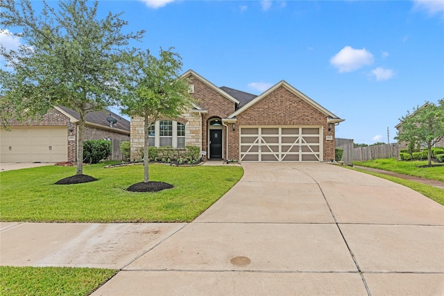 19647 Travis Cannon Ln, Richmond, TX 77407 - view of front of home with a garage, concrete driveway, and brick siding