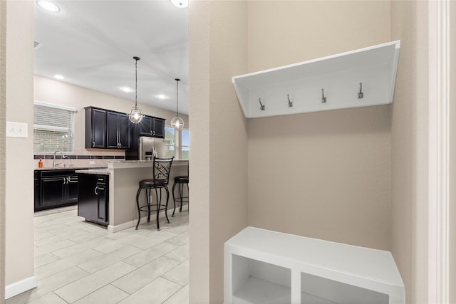 19647 Travis Cannon Ln, Richmond, TX 77407 - mudroom with healthy amount of natural light and recessed lighting