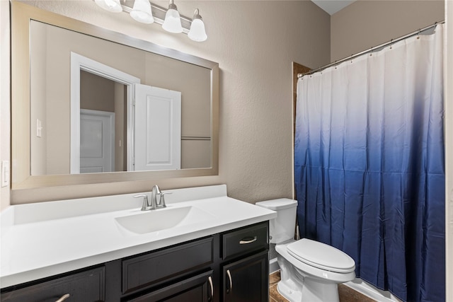 19647 Travis Cannon Ln, Richmond, TX 77407 - bathroom featuring vanity, a textured wall, and a shower with curtain