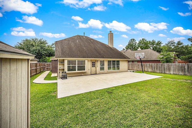15323 Southwood Trace Ln, Houston, TX 77049 - back of house with a chimney, a fenced backyard, and a patio area
