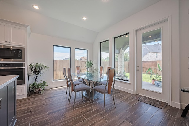 7246 Monarch Dr, Katy, TX 77493 - dining area featuring dark wood-style flooring, vaulted ceiling, and recessed lighting