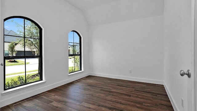 7246 Monarch Dr, Katy, TX 77493 - unfurnished room featuring vaulted ceiling and dark wood-style flooring