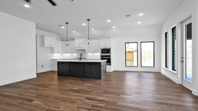 7246 Monarch Dr, Katy, TX 77493 - kitchen with stainless steel appliances, open floor plan, healthy amount of natural light, a center island with sink, and recessed lighting