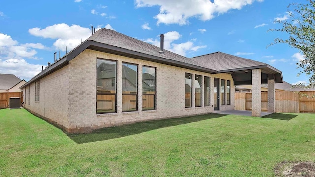 7246 Monarch Dr, Katy, TX 77493 - back of property with brick siding and a shingled roof