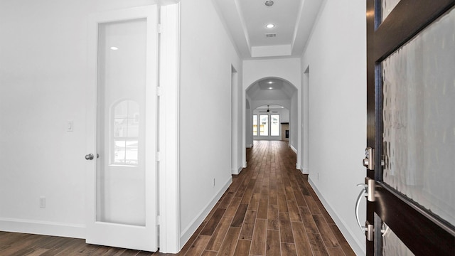 7246 Monarch Dr, Katy, TX 77493 - hallway featuring arched walkways, dark wood-type flooring, and recessed lighting