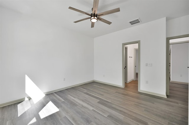 4 Hanover Ln, Panorama Village, TX 77304 - unfurnished bedroom featuring wood finished floors and a ceiling fan