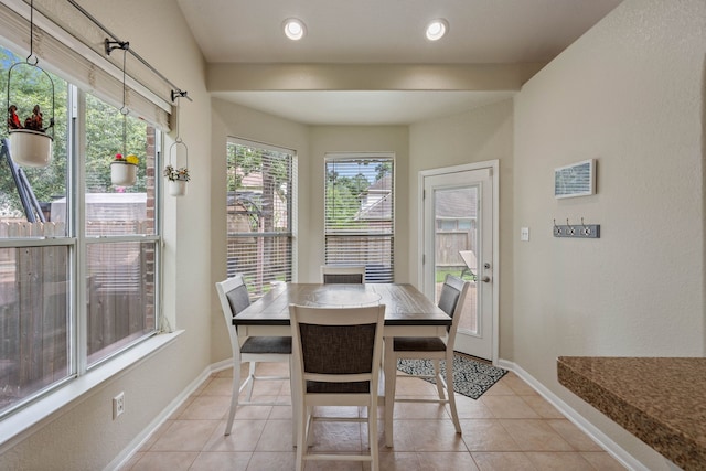 23 Murmuring Creek Pl, The Woodlands, TX 77385 - dining space featuring light tile patterned floors and baseboards