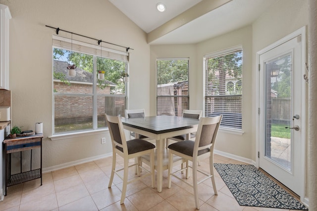 23 Murmuring Creek Pl, The Woodlands, TX 77385 - dining space with plenty of natural light, light tile patterned floors, and lofted ceiling