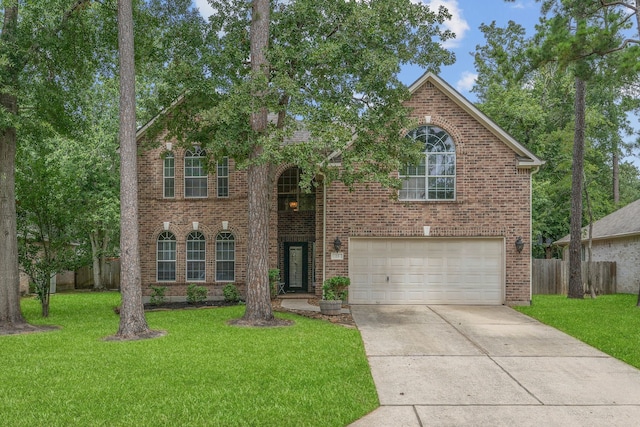 23 Murmuring Creek Pl, The Woodlands, TX 77385 - view of front of home with a garage, concrete driveway, and brick siding