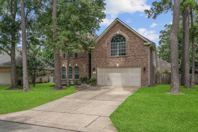23 Murmuring Creek Pl, The Woodlands, TX 77385 - view of front of property with brick siding, driveway, and a garage