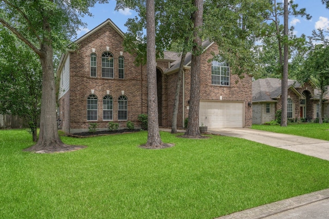 23 Murmuring Creek Pl, The Woodlands, TX 77385 - view of front of property with concrete driveway, brick siding, and a front yard