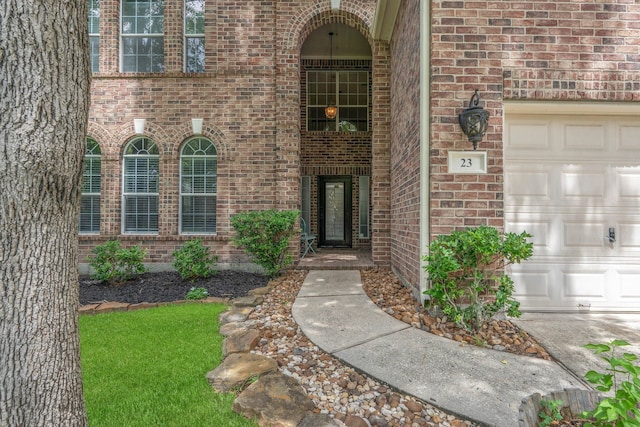 23 Murmuring Creek Pl, The Woodlands, TX 77385 - doorway to property featuring brick siding