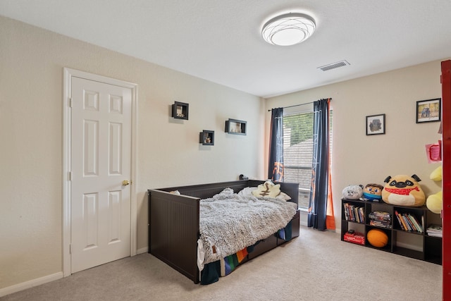 23 Murmuring Creek Pl, The Woodlands, TX 77385 - bedroom featuring light carpet and baseboards