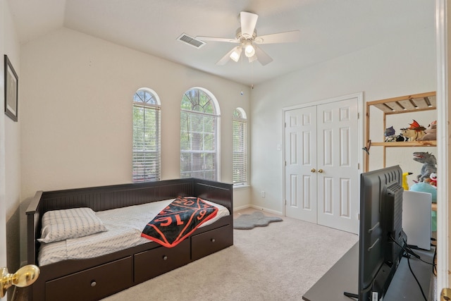 23 Murmuring Creek Pl, The Woodlands, TX 77385 - bedroom with carpet floors, a ceiling fan, a closet, and vaulted ceiling