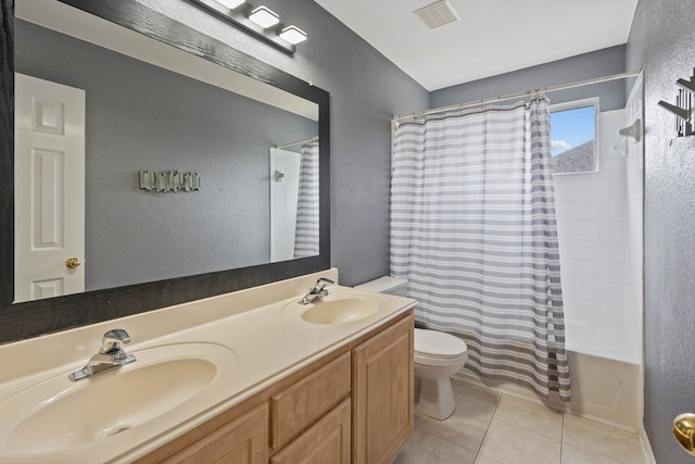 23 Murmuring Creek Pl, The Woodlands, TX 77385 - bathroom with a textured wall, tile patterned floors, double vanity, and shower / tub combo with curtain