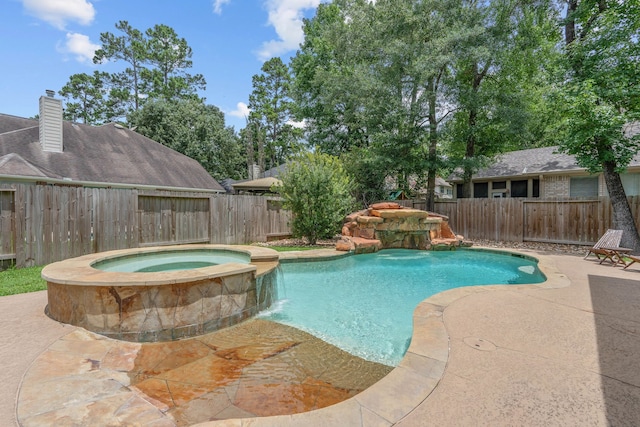 23 Murmuring Creek Pl, The Woodlands, TX 77385 - view of swimming pool with a fenced backyard, a pool with connected hot tub, and a patio