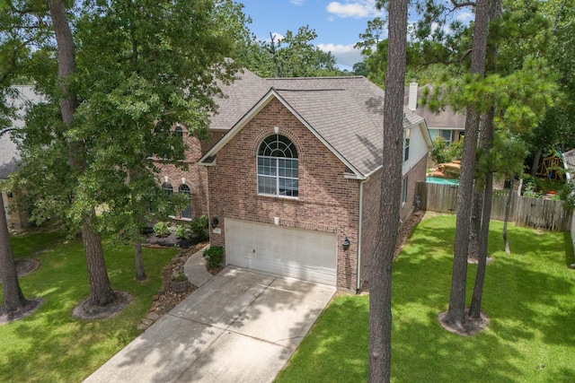 23 Murmuring Creek Pl, The Woodlands, TX 77385 - traditional-style house with brick siding, an attached garage, roof with shingles, driveway, and a chimney