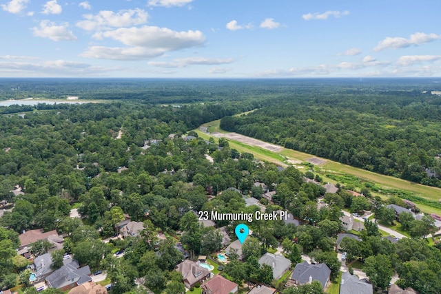 23 Murmuring Creek Pl, The Woodlands, TX 77385 - bird's eye view of a heavily wooded area
