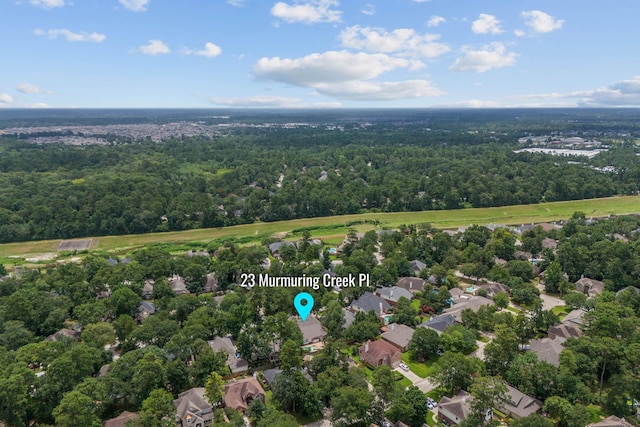 23 Murmuring Creek Pl, The Woodlands, TX 77385 - aerial view of residential area with a forest