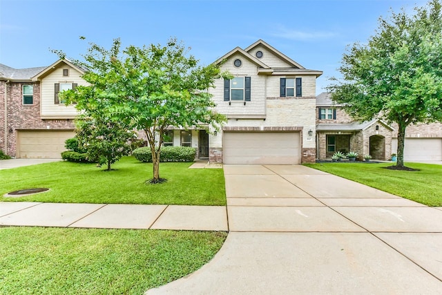 10147 Cimarron Canyon Ln, Magnolia, TX 77354 - view of front facade featuring a garage, a front lawn, driveway, stone siding, and brick siding