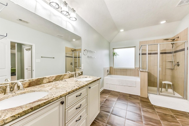 10147 Cimarron Canyon Ln, Magnolia, TX 77354 - full bathroom featuring a garden tub, a stall shower, double vanity, lofted ceiling, and tile patterned flooring