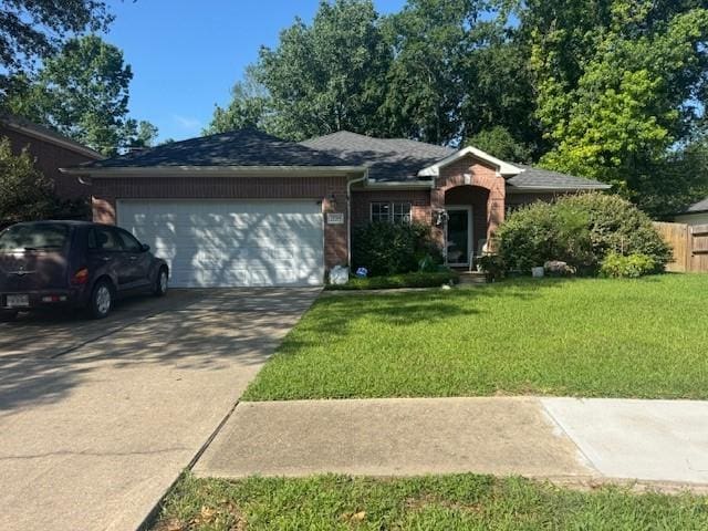 22215 Jay Dr, Spring, TX 77373 - ranch-style home with a garage, concrete driveway, brick siding, and roof with shingles