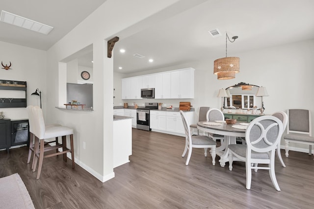 11739 Armadale Dr, Tomball, TX 77375 - dining room with dark wood-type flooring, recessed lighting, and a chandelier