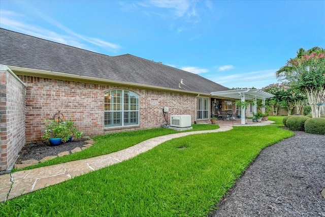 2316 Flagship Ct, League City, TX 77573 - back of house featuring a pergola, a yard, a patio area, and roof with shingles