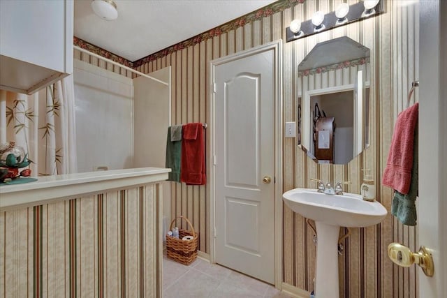 2316 Flagship Ct, League City, TX 77573 - full bathroom with wallpapered walls, tile patterned floors, and a shower