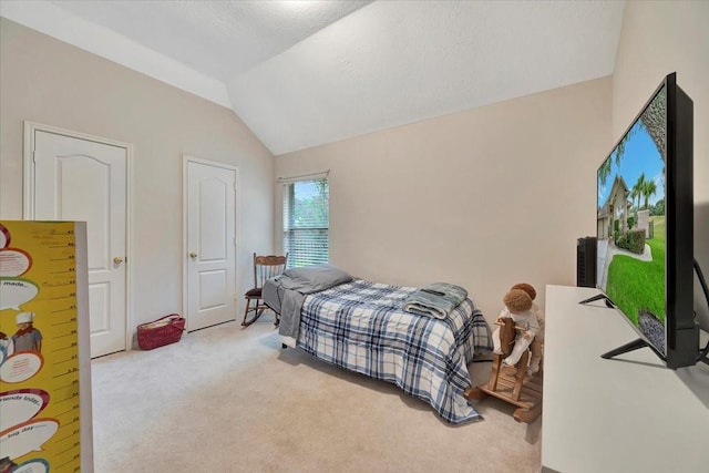 2316 Flagship Ct, League City, TX 77573 - bedroom with light colored carpet and vaulted ceiling
