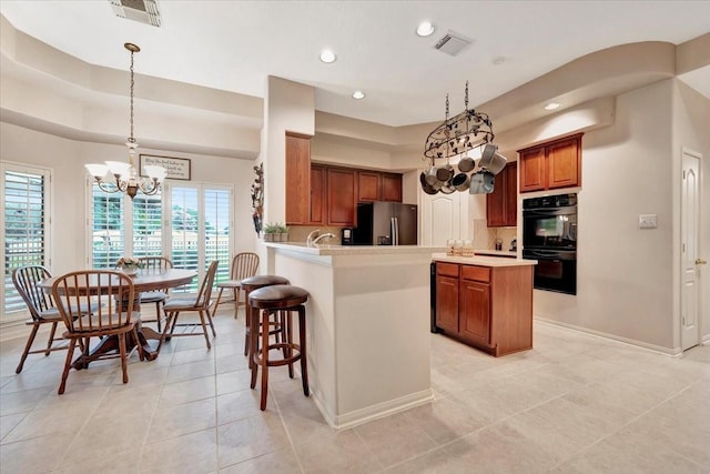 2316 Flagship Ct, League City, TX 77573 - kitchen featuring stainless steel fridge with ice dispenser, a chandelier, brown cabinetry, light countertops, and light tile patterned floors