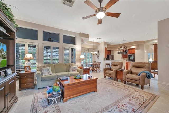 2316 Flagship Ct, League City, TX 77573 - living room with a ceiling fan, a chandelier, light tile patterned flooring, and recessed lighting
