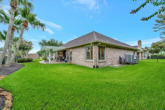 2316 Flagship Ct, League City, TX 77573 - rear view of property featuring a patio area, brick siding, and a chimney