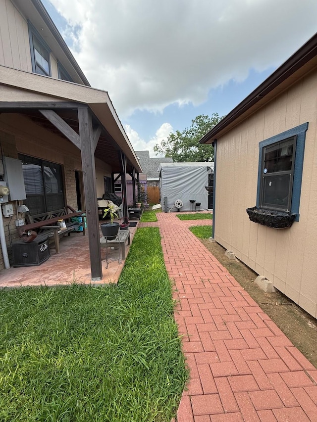 7402 Burkridge Dr, Houston, TX 77041 - view of green lawn featuring a patio area