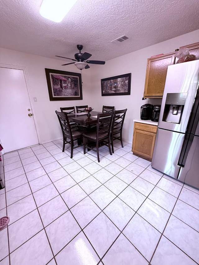 7402 Burkridge Dr, Houston, TX 77041 - dining room featuring a ceiling fan, a textured ceiling, and light tile patterned floors