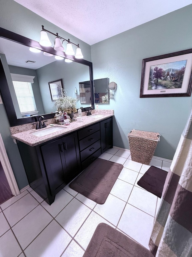7402 Burkridge Dr, Houston, TX 77041 - bathroom with a textured ceiling, tile patterned floors, and double vanity