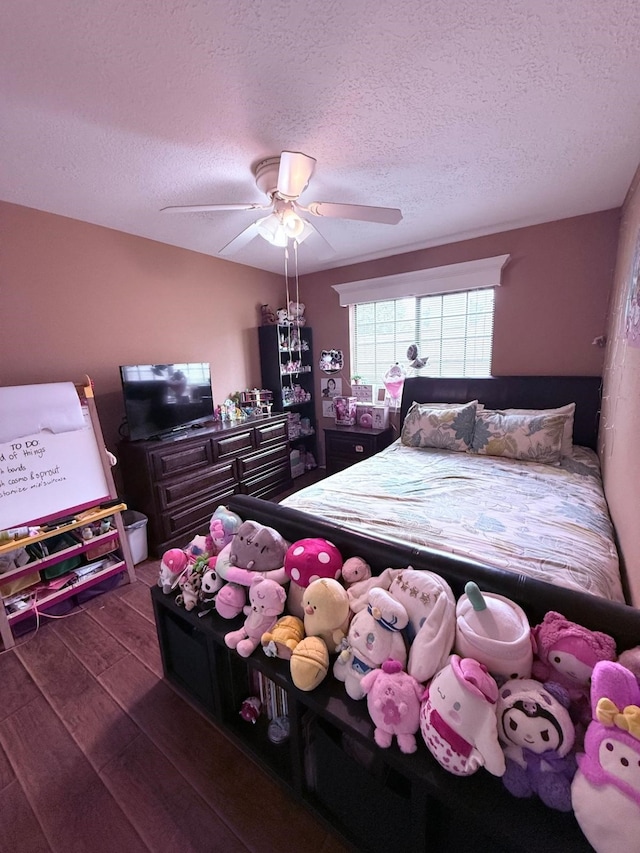7402 Burkridge Dr, Houston, TX 77041 - bedroom featuring wood finished floors, a textured ceiling, and a ceiling fan