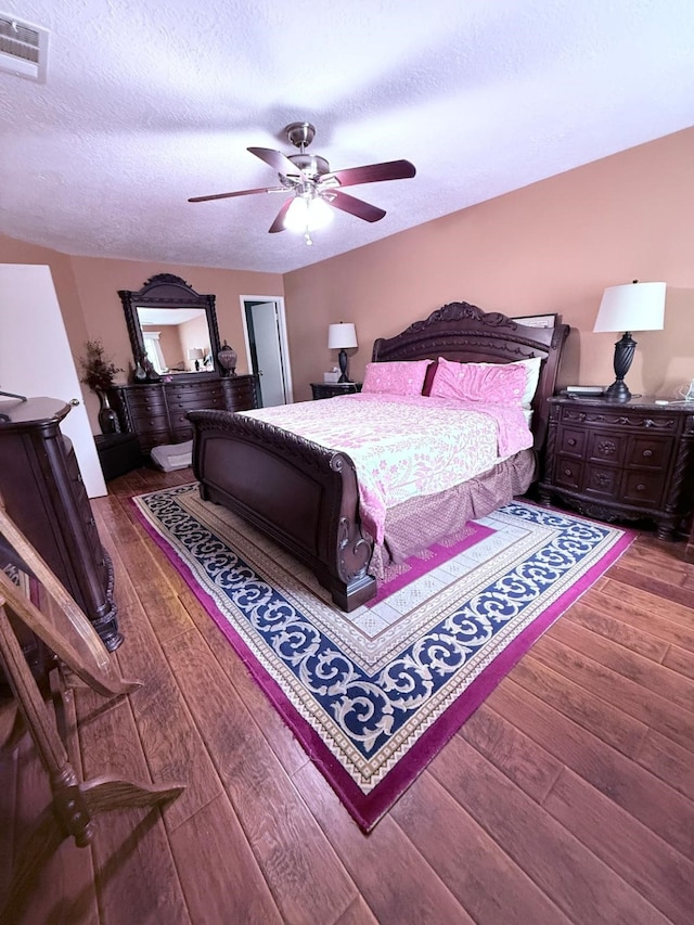 7402 Burkridge Dr, Houston, TX 77041 - bedroom with hardwood / wood-style floors, a textured ceiling, and ceiling fan
