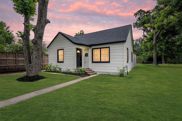 6935 Palmetto St, Houston, TX 77087 - view of front of home with a shingled roof and a fenced backyard