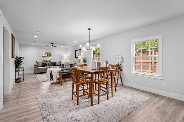 6935 Palmetto St, Houston, TX 77087 - dining room featuring light wood-type flooring, recessed lighting, ceiling fan, and a chandelier