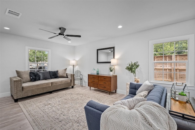 6935 Palmetto St, Houston, TX 77087 - living area featuring plenty of natural light, light wood-style flooring, a ceiling fan, and recessed lighting