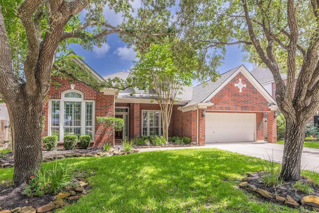 4611 Camden Brook Ln, Katy, TX 77494 - view of front of house featuring brick siding, a front yard, a garage, and driveway