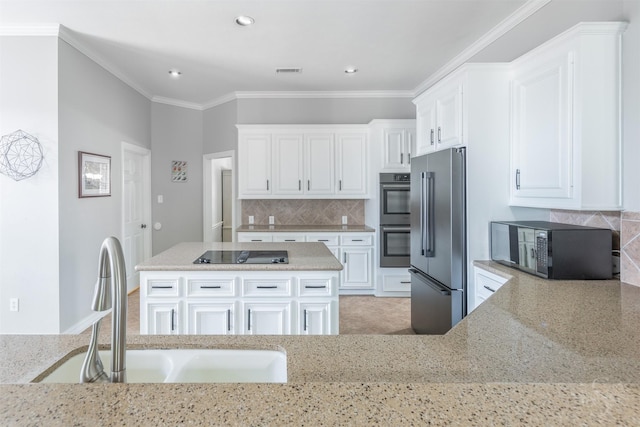 4611 Camden Brook Ln, Katy, TX 77494 - kitchen featuring black appliances, light stone countertops, decorative backsplash, white cabinetry, and recessed lighting
